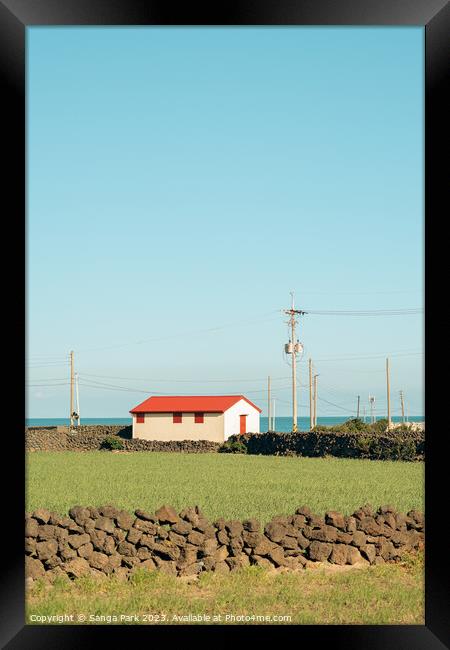 House and green field at Jeju island in Korea Framed Print by Sanga Park