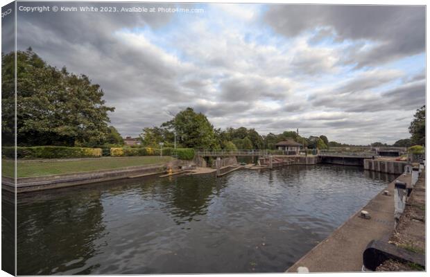 Riverside view towards Molesey Lock near Hampton Court Bridge Canvas Print by Kevin White