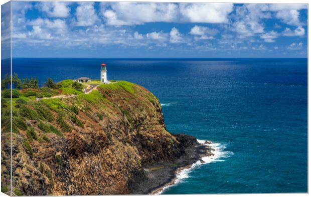 Kilauae lighthouse on headland against blue sky on Kauai Canvas Print by Steve Heap