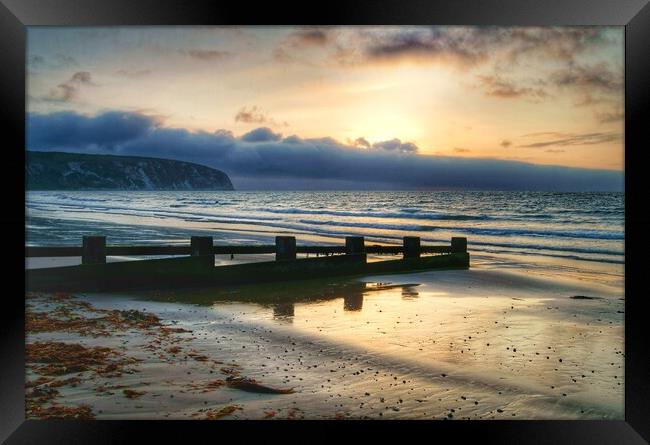 Sunrise over Swanage Bay, Dorset  Framed Print by Darren Galpin