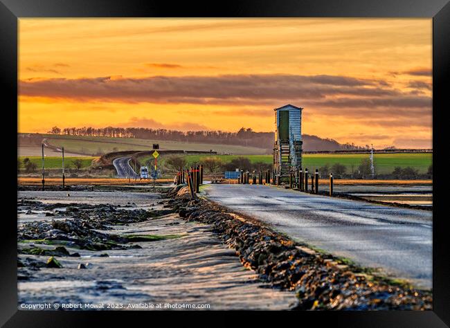 The Lindisfarne Causeway at dusk Framed Print by Robert Mowat