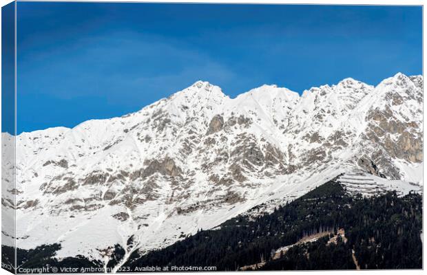 Landscape of snow capped mountains and ski resort  Canvas Print by Ambrosini V