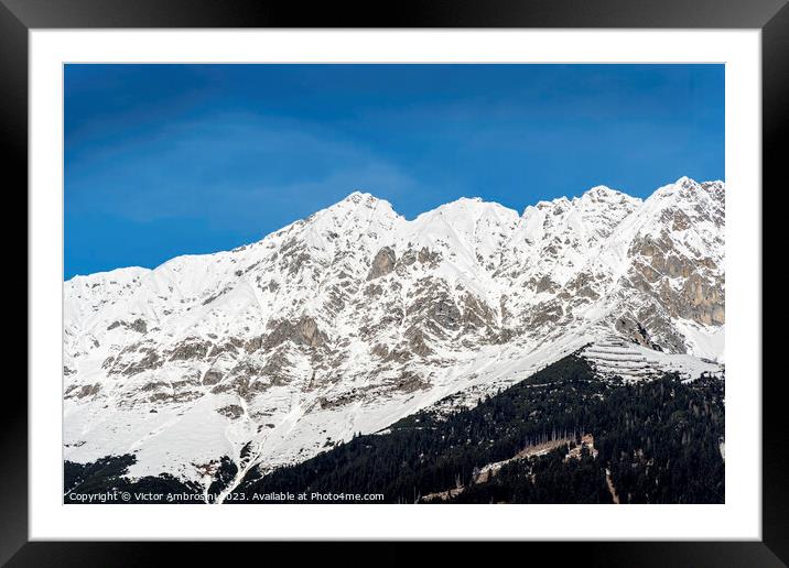 Landscape of snow capped mountains and ski resort  Framed Mounted Print by Ambrosini V