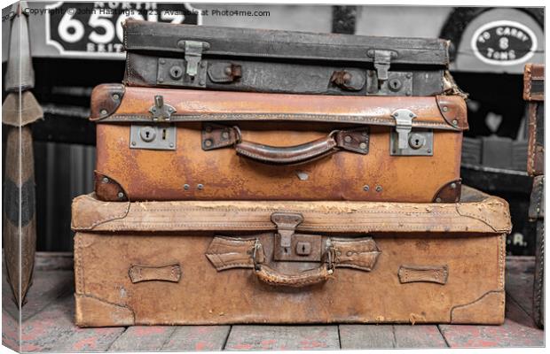 Vintage Suitcases Stacked High Canvas Print by John Hastings