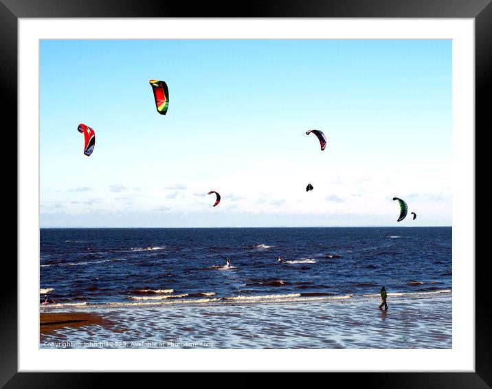 Harnessing Coastal Breezes: Kite Surfers at Norfol Framed Mounted Print by john hill