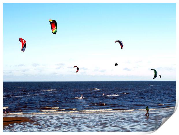 Harnessing Coastal Breezes: Kite Surfers at Norfol Print by john hill