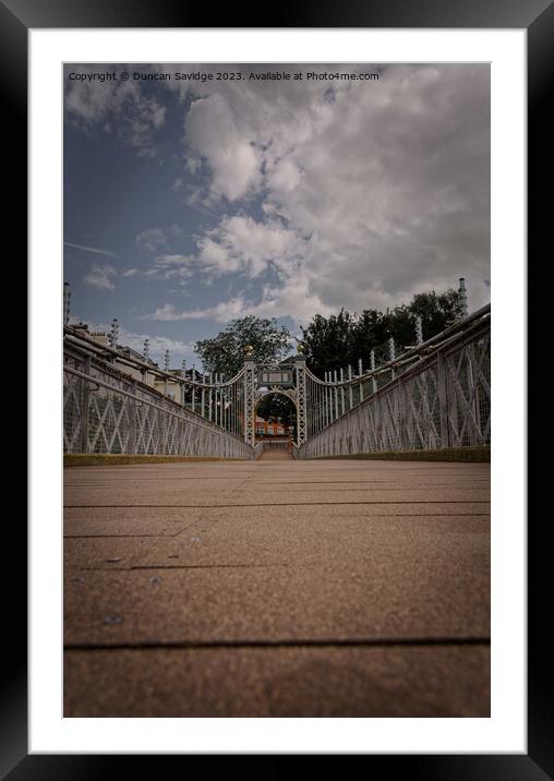 The Queens Park Suspension Bridge is a footbridge crossing the river Dee in Chester at the Groves. Framed Mounted Print by Duncan Savidge