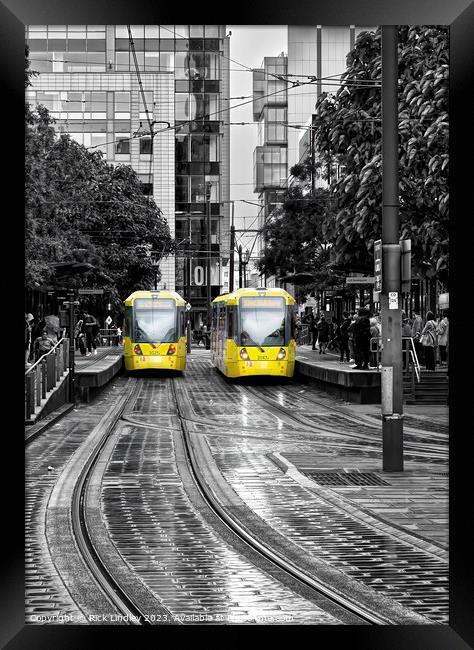 Manchester Trams In The Rain Framed Print by Rick Lindley