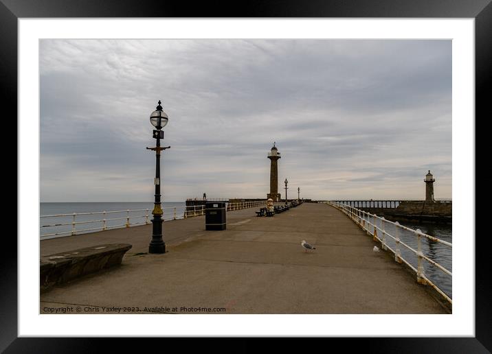 The east pier in the seaside town of Whitby on the Framed Mounted Print by Chris Yaxley
