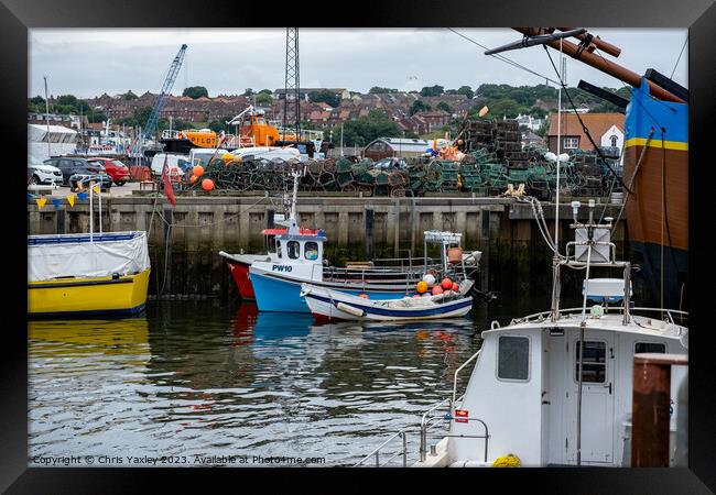 Fishing boats in Whitby harbour Framed Print by Chris Yaxley
