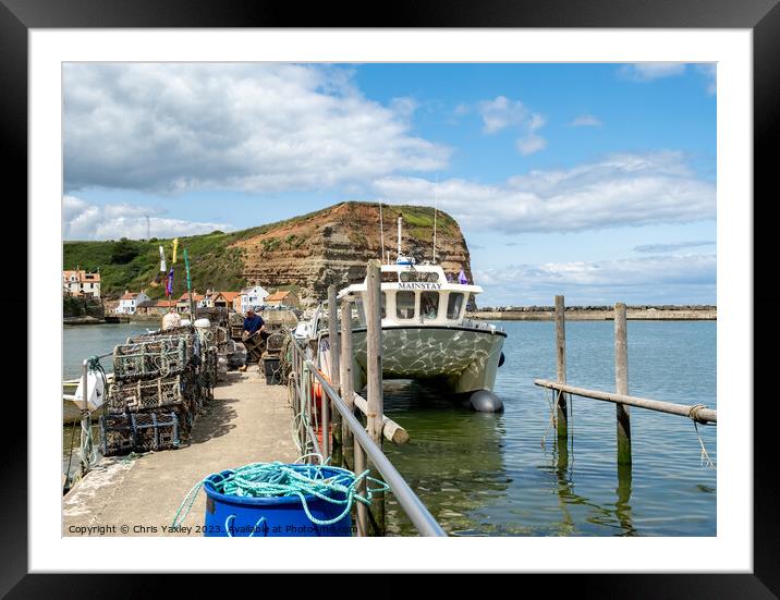 Fishing boat in Staithes harbour Framed Mounted Print by Chris Yaxley