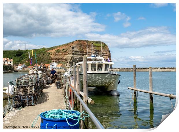 Fishing boat in Staithes harbour Print by Chris Yaxley