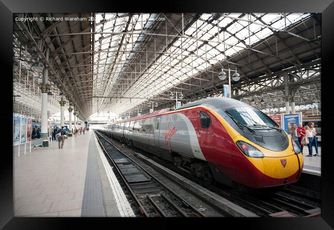 Manchester UK Virgin Trains high speed train Framed Print by Richard Wareham