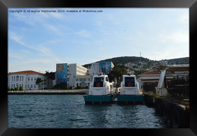 Serene Waterside Mooring Framed Print by Ali asghar Mazinanian