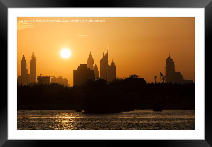 Sun sets over Dubai Creek  Framed Mounted Print by Richard Wareham