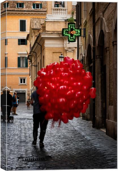 Men With Red Balloons On Cobblestone Street Canvas Print by Artur Bogacki
