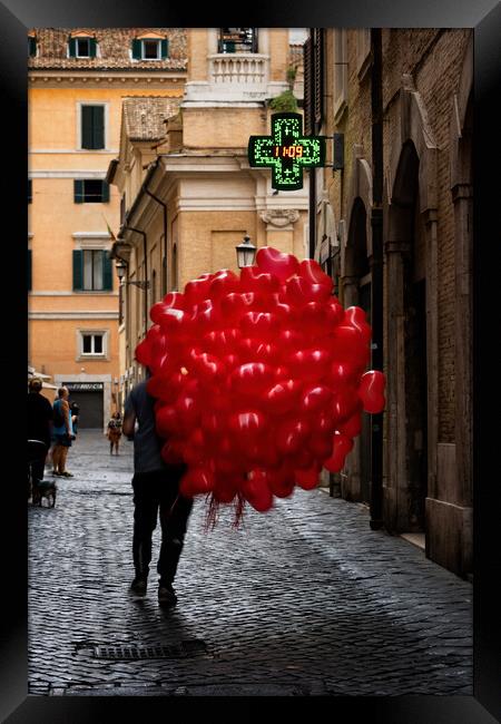 Men With Red Balloons On Cobblestone Street Framed Print by Artur Bogacki