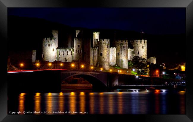 Illuminated Conwy Castle: A Nighttime Spectacle Framed Print by Mike Shields