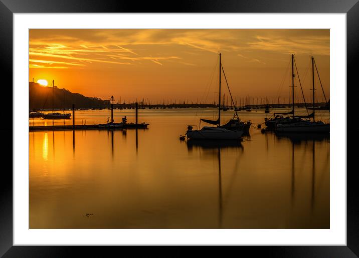 Sunrise peaking over the mainland Framed Mounted Print by Rob Lucas