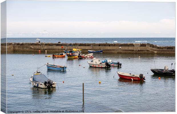 Fishing boats in Staithes Harbour Canvas Print by Chris Yaxley