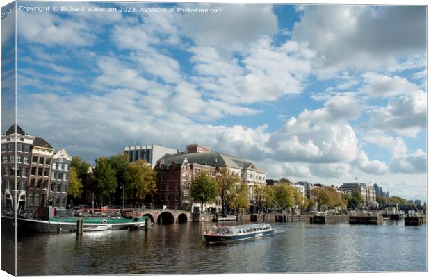 River Amstel with Royal Theatre Carre  Canvas Print by Richard Wareham