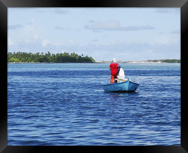 small boat in the sea Framed Print by Hassan Najmy