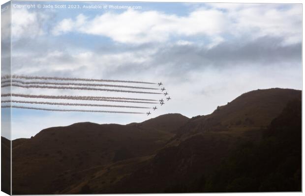 Red arrows over ochils  Canvas Print by Jade Scott