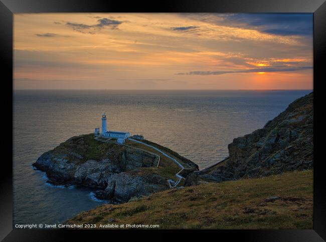 South Stack Lighthouse at Sunset Framed Print by Janet Carmichael