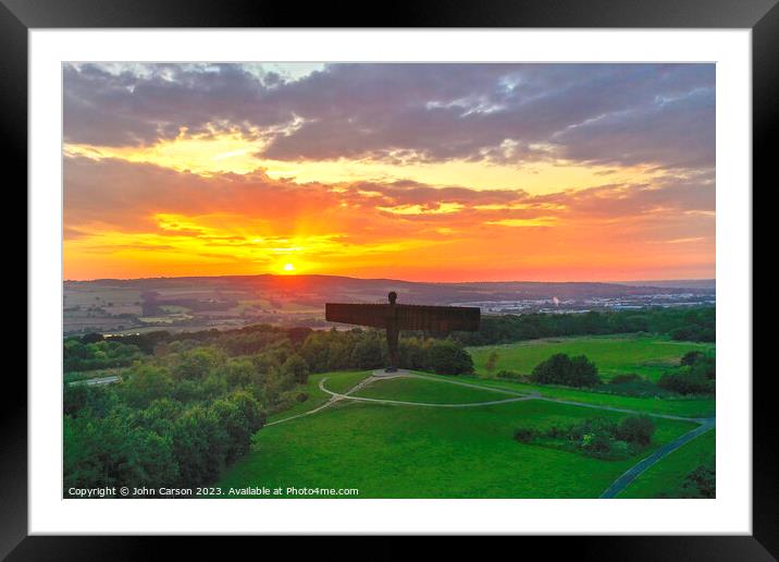 A sunset over the Angel of the north Framed Mounted Print by John Carson