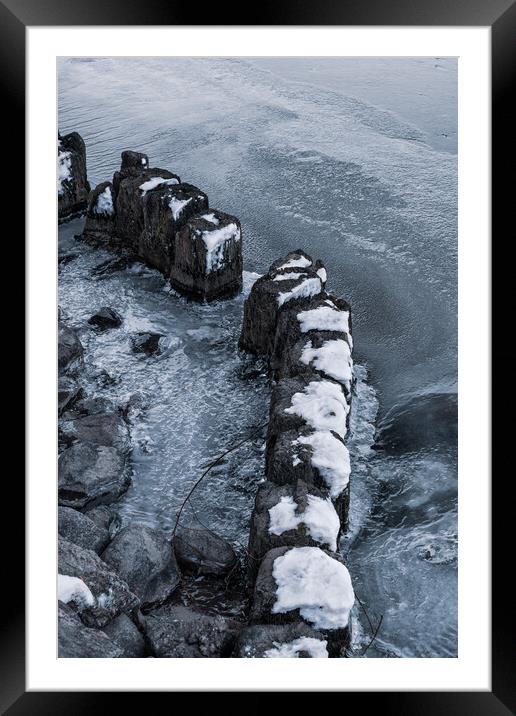 Old Wooden Posts In Frozen River Framed Mounted Print by Artur Bogacki