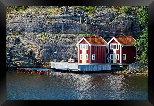 Boathouses on Orust Island in Western Sweden Framed Print by Martyn Arnold