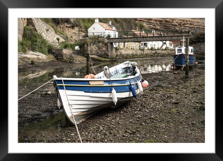 Fishing boat in the seaside village of Staithes Framed Mounted Print by Chris Yaxley