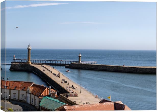 Whitby East and West Piers Canvas Print by Chris Yaxley