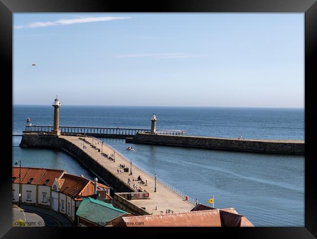 Whitby East and West Piers Framed Print by Chris Yaxley