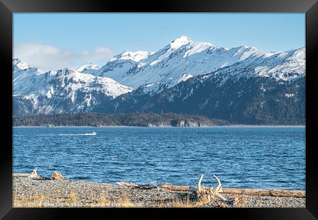 The mountains of Lake Clark National Park and Preserve from the Kenai Peninsular across the Cook Inlet.n Framed Print by Dave Collins
