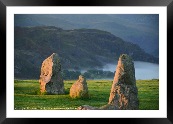 Dawn mist at the Neolithic stones Framed Mounted Print by Malcolm Snook