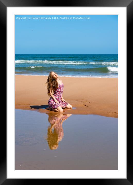 Pretty young woman in sundress at the beach on a s Framed Mounted Print by Howard Kennedy