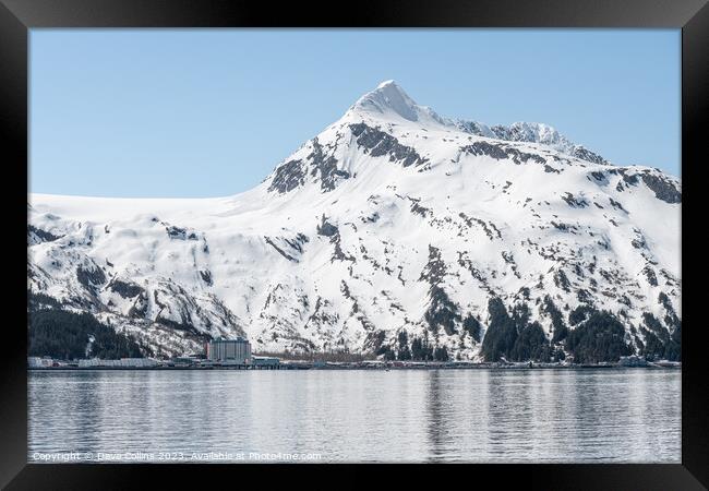 The Begich Towers Condominium building and snow covered mountains behind, Whittier, Alaska, USA Framed Print by Dave Collins