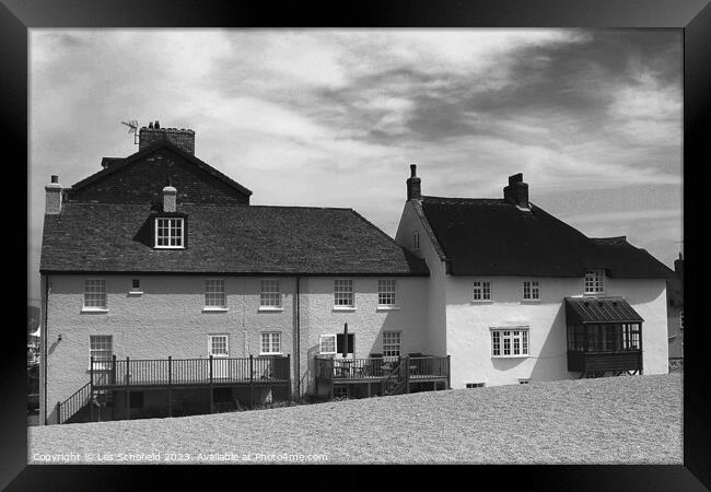 West Bay Beach Cottages Framed Print by Les Schofield