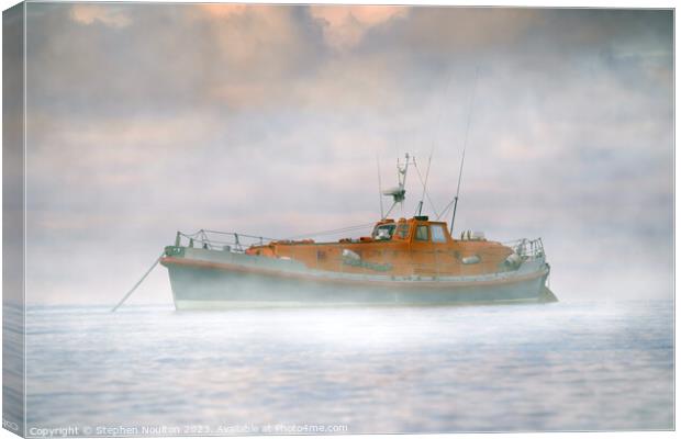 Retired Lifeboat on still water in the Sea Mist Canvas Print by Stephen Noulton