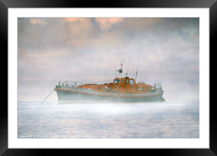Retired Lifeboat on still water in the Sea Mist Framed Mounted Print by Stephen Noulton