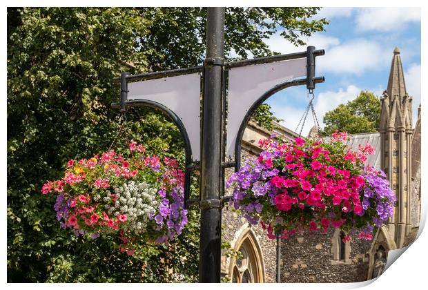 Hanging baskets outside St Marys Church, High Wycombe Print by Kevin Hellon