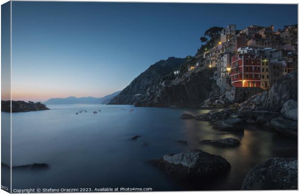 Blue twilight over the fishing village of Riomaggiore. Cinque Te Canvas Print by Stefano Orazzini
