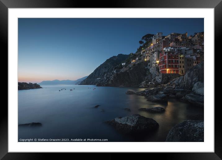 Blue twilight over the fishing village of Riomaggiore. Cinque Te Framed Mounted Print by Stefano Orazzini