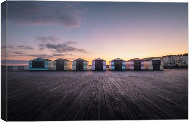 Hastings Pier Beach Huts Canvas Print by Mark Jones