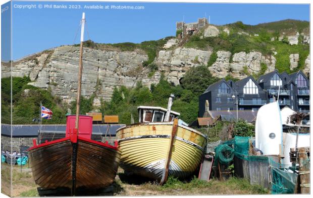 Boats, Old Town Net Shops and Cliffs at Hastings, East Sussex Canvas Print by Phil Banks