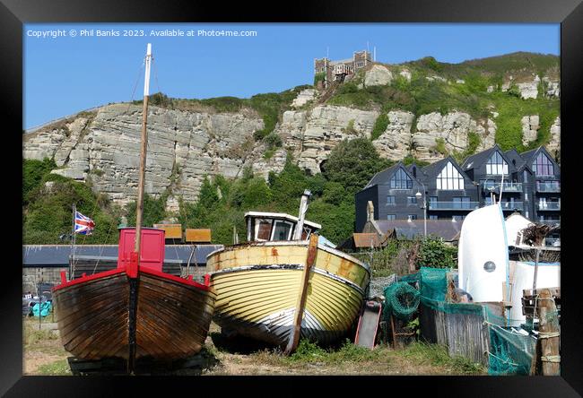 Boats, Old Town Net Shops and Cliffs at Hastings, East Sussex Framed Print by Phil Banks