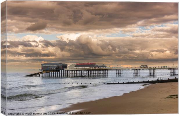 Cromer Pier in the Evening Sun as a Storm rolled i Canvas Print by Heidi Hennessey