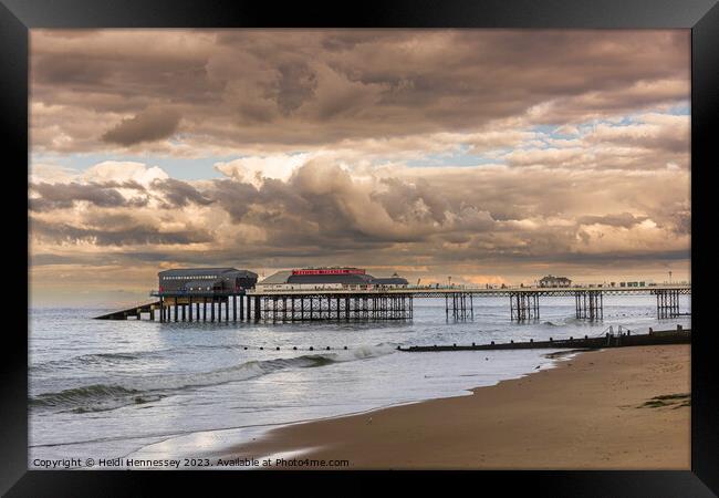 Cromer Pier in the Evening Sun as a Storm rolled i Framed Print by Heidi Hennessey