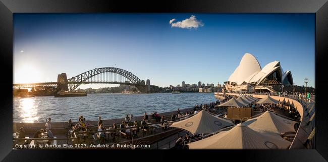 The world famous Sydney Opera House and Harbour Bridge at sunset Framed Print by Gordon Elias